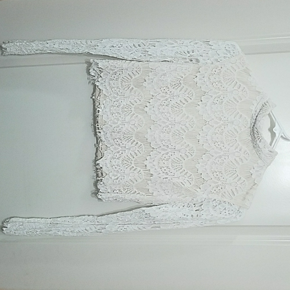 White long sleeve lace crop top with open back